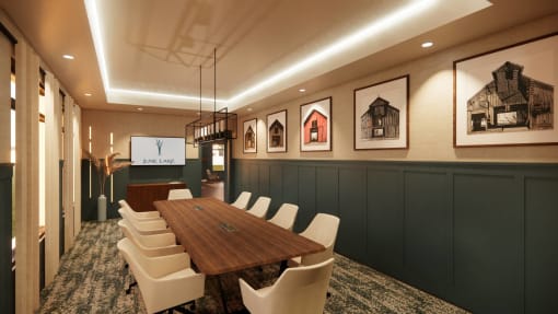 a conference room with a wooden table and chairs and pictures on the wall