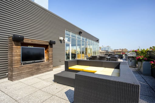 the patio has a fireplace and outdoor furniture