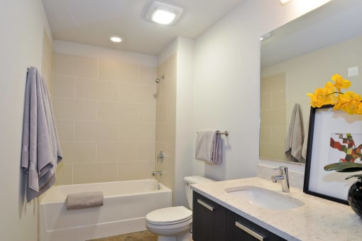 a bathroom with a sink toilet and a bath tub