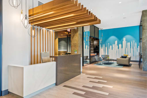the lobby or reception area of a hotel with a reception desk