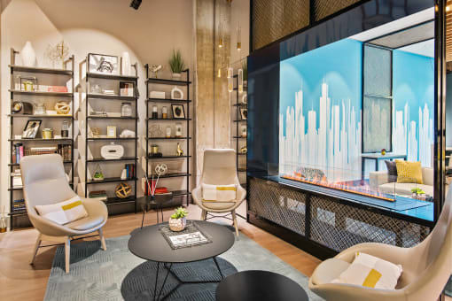 a living room with chairs and a large television