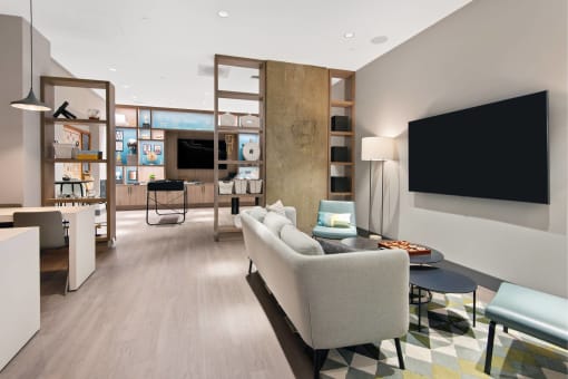 a living room filled with furniture and a tv