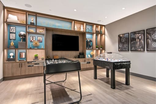 a store with a counter and a television on the wall