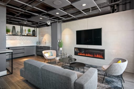 a living room with a fireplace and a tv