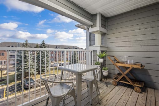Outdoor patio with a seating area and parking lot view