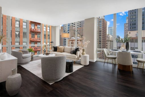 a living room with couches and chairs and a large window