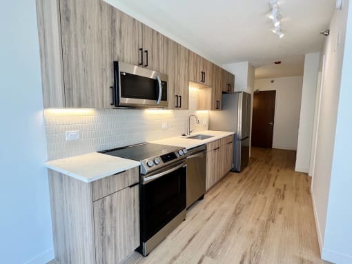 a kitchen with a stove and a microwave