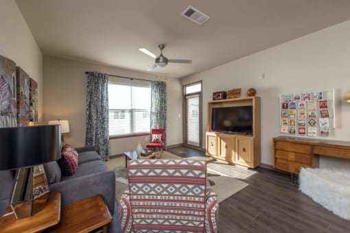 a living room with a couch and a tv