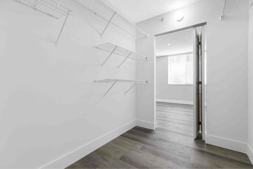 a room with white walls and a sliding glass door