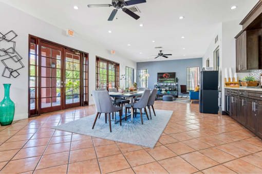 a dining room with a table and chairs