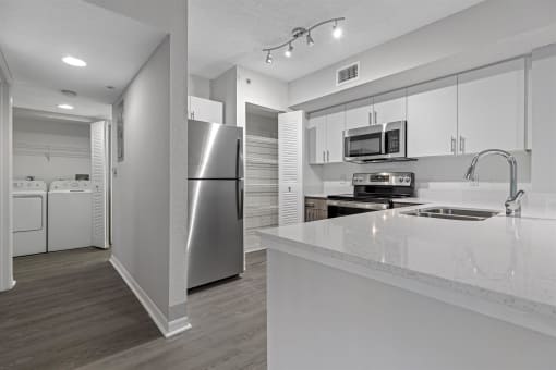 Spacious floor plans with wood vinyl throughout, stainless steel kitchen packages, upgraded fixtures and white and wood accents