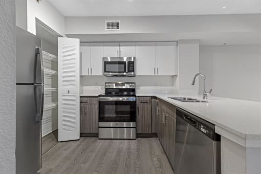 Spacious floor plans with wood vinyl throughout, stainless steel kitchen packages, upgraded fixtures and white and wood accents