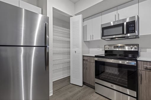 Spacious floor plans with wood vinyl throughout, stainless steel kitchen packages, upgraded fixtures and white and wood accents
