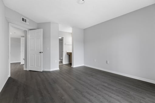 Open concept floor plans with large windows, vinyl wood flooring throughout, stainless steel kitchens, upgraded lighting with white and wood accents
