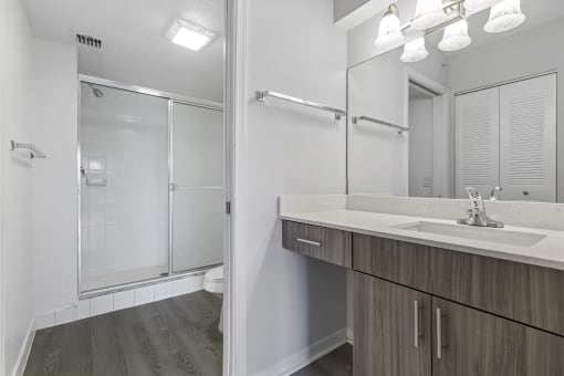 Open concept floor plans with large windows, vinyl wood flooring throughout, stainless steel kitchens, upgraded lighting with white and wood accents