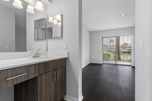 Open concept floor plans with large windows, vinyl wood flooring throughout, stainless steel kitchens, upgraded lighting with white and wood accents
