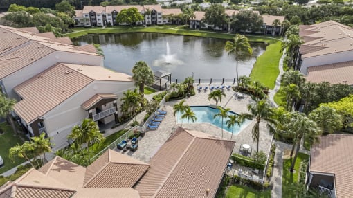 an aerial view of a house with a pool and a fountain