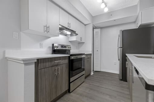 Spacious floor plans with wood vinyl throughout, stainless steel kitchen packages, upgraded fixtures and white and wood accents