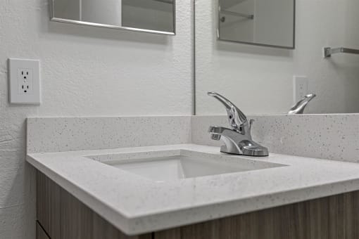 a bathroom with a sink and a mirror