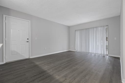 Open concept floor plans with large windows, vinyl wood flooring throughout, stainless steel kitchens, upgraded lighting with white and wood accents