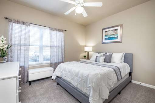 Big oaks apartments lakeland florida furnished bedroom with ceiling fan and carpet