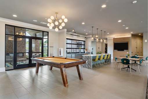 Community Billiards Room with Bar Area, Tables, Seating, and Large