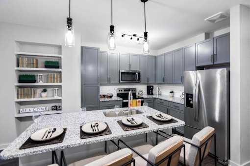 The Sound at Pennington Bend Interior-Kitchen with Stainless Steel Appliances and Granite Countertops