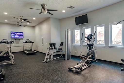 the gym at the flats at big tex apartments