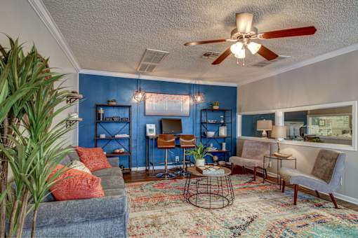 Resident Clubroom with couch seating and computer desk