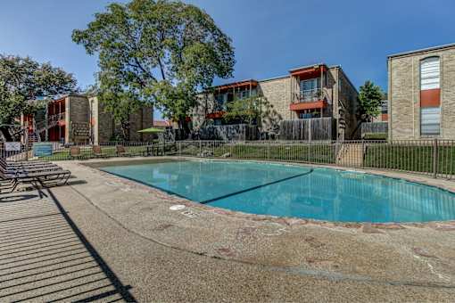 Swimming Pool surrounded by Oak Terrace apartment community