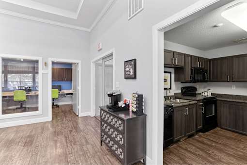 A kitchen with dark wood cabinets and a black and white patterned refrigerator.