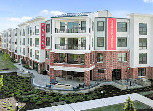 A building with a red sign that says New Ventures.