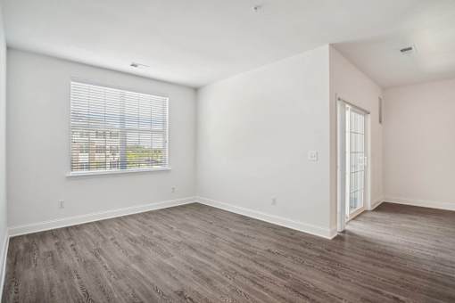 A room with a window and a door.