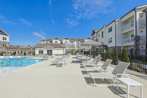 our apartments have a large pool and lounge chairs