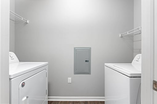A laundry room with a washer and dryer.