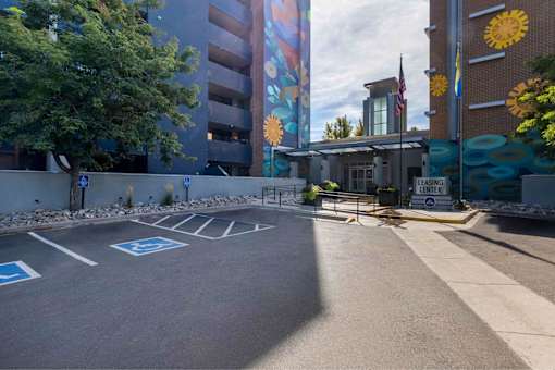 A parking lot with a sign that says "LEASING CENTER".