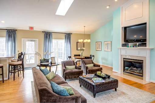 A living room with a fireplace and a couch.