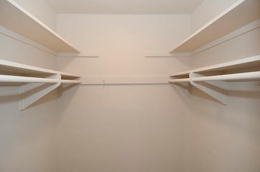 Empty white shelves in a room.
