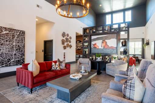 A living room with a red couch and a coffee table.