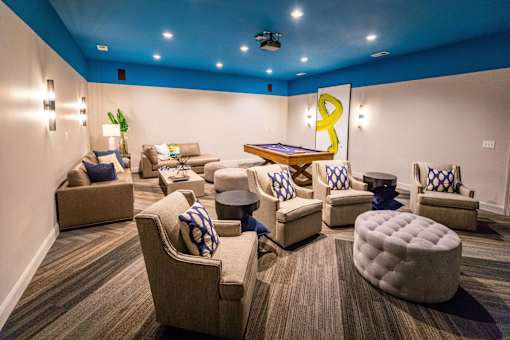 A room with a blue ceiling and furniture.