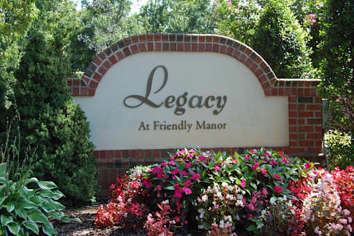 A sign that says Legacy at Friendly Manor.