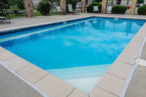 A rectangular pool with a white border.