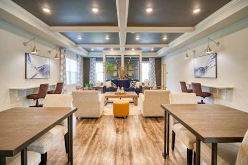 A modern living room with a wooden floor and furniture.