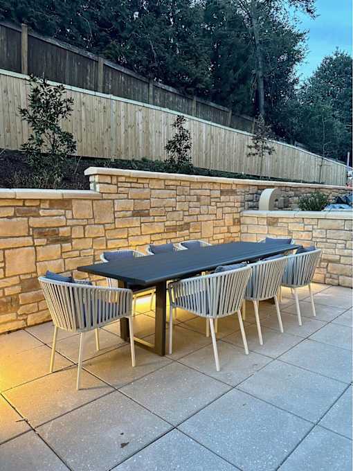 A table with chairs is set up outside on a patio.