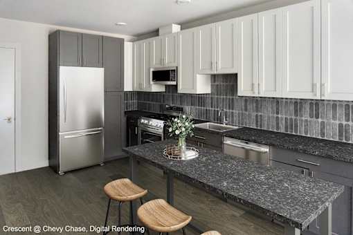 A kitchen with a refrigerator, microwave, oven, and sink.