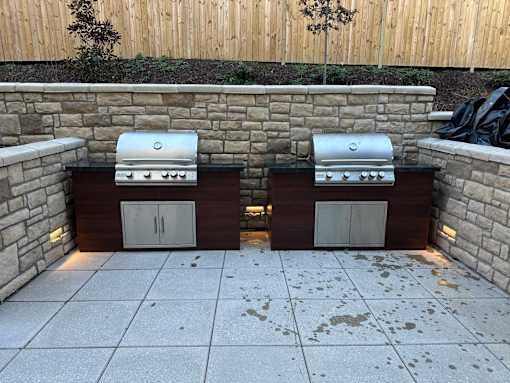 Two grills are built into a wall.