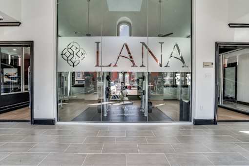 The entrance to a Lana store with glass doors and a glass window above the entrance.