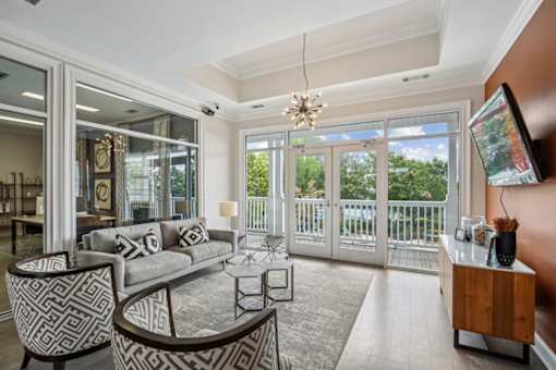 A living room with a grey couch and a coffee table.