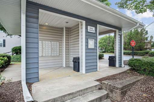 A small building with a sign that says "Mail Center" on it.