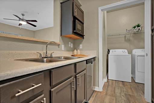 A laundry sign is on the wall in the laundry room.